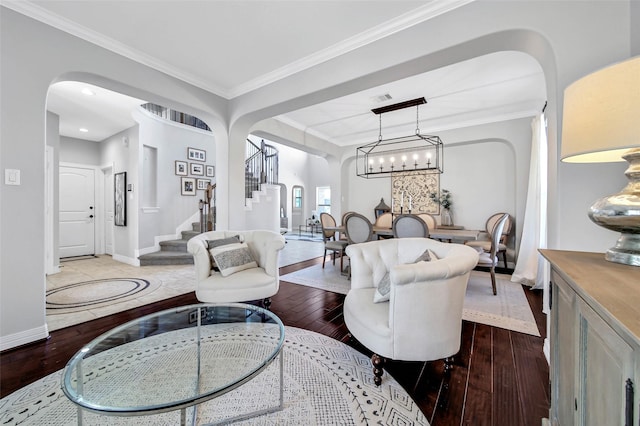 living room with crown molding and hardwood / wood-style floors