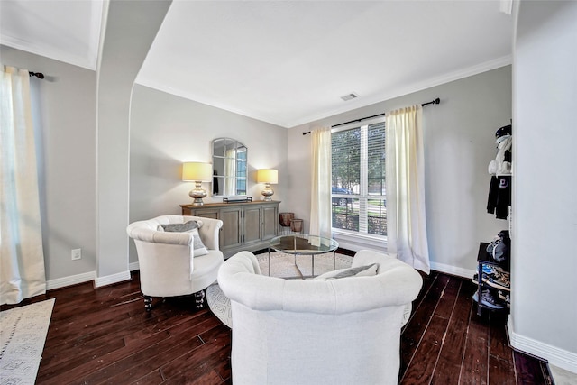 living room featuring dark hardwood / wood-style flooring and ornamental molding