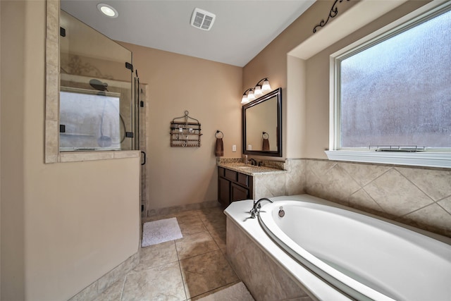 bathroom with tile patterned floors, vanity, and plus walk in shower