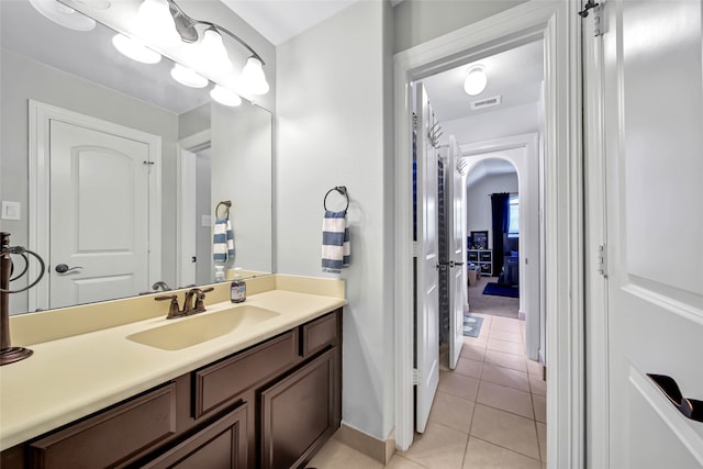 bathroom featuring tile patterned floors and vanity