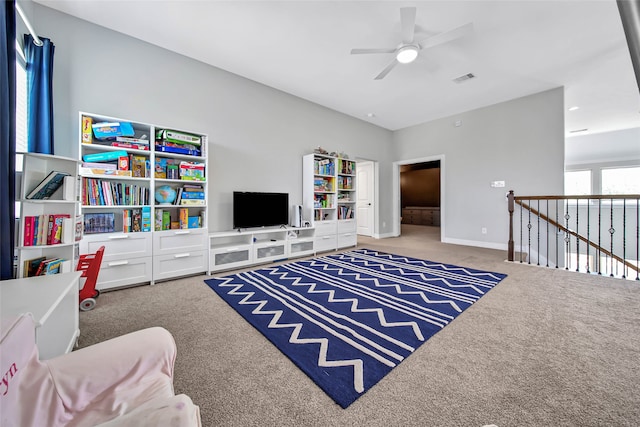 interior space featuring carpet floors and ceiling fan