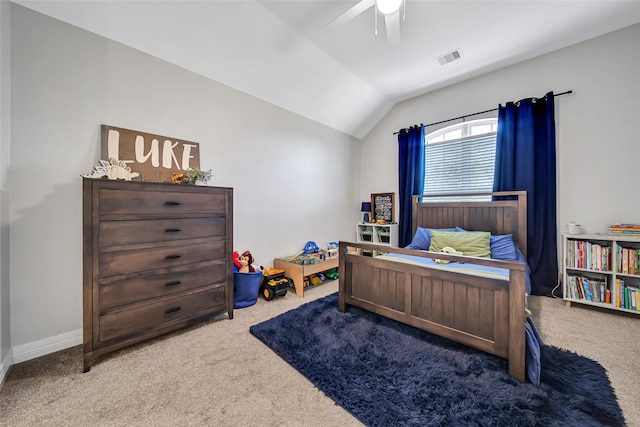 bedroom featuring ceiling fan, carpet floors, and vaulted ceiling