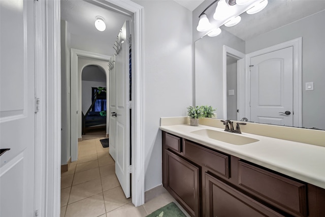 bathroom featuring tile patterned flooring and vanity