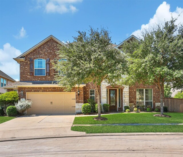 view of front of house featuring a front yard and a garage