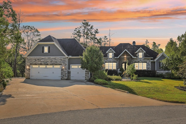 38134 Cascade Ct, Magnolia, TX 77354 - craftsman inspired home featuring stone siding, a lawn, driveway, an attached garage, and a chimney