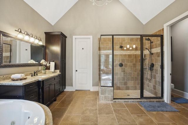 38134 Cascade Ct, Magnolia, TX 77354 - bathroom featuring a shower stall, vanity, a tub with jets, and high vaulted ceiling