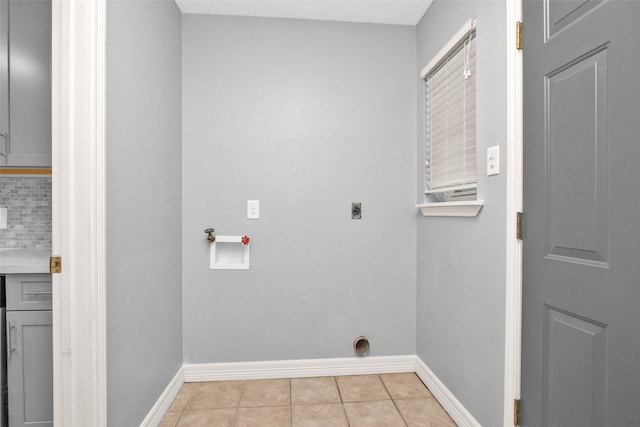 laundry room featuring hookup for a washing machine, light tile patterned flooring, and hookup for an electric dryer