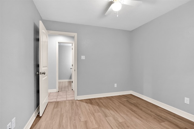 unfurnished bedroom featuring ceiling fan and light hardwood / wood-style flooring