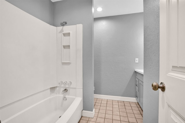 bathroom featuring tile patterned floors, vanity, and washtub / shower combination