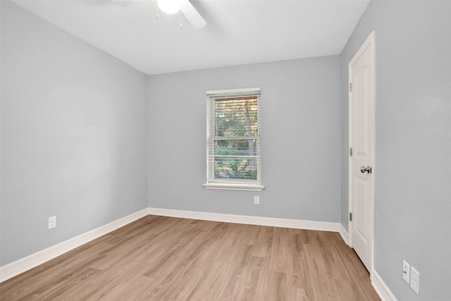 empty room featuring ceiling fan and light wood-type flooring