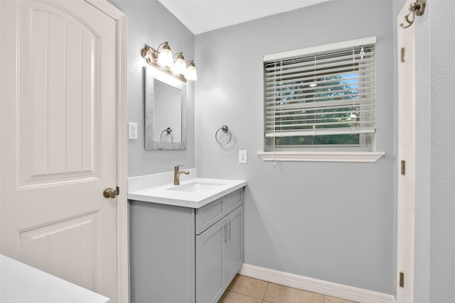 bathroom with tile patterned flooring and vanity