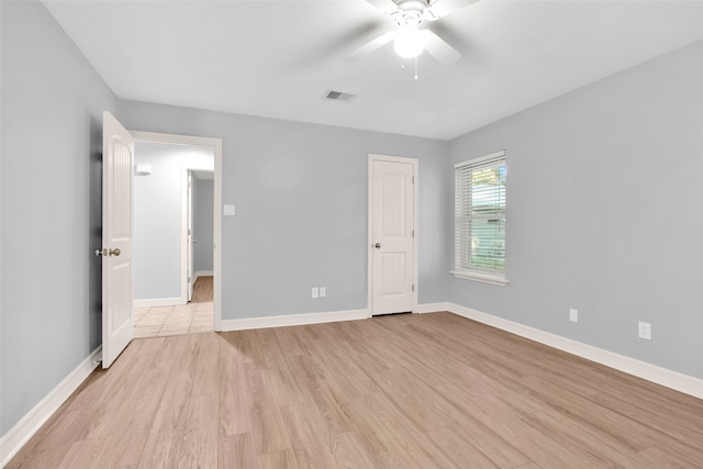 unfurnished bedroom with ceiling fan and light hardwood / wood-style flooring