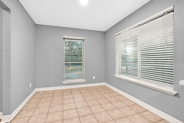 spare room with light tile patterned flooring