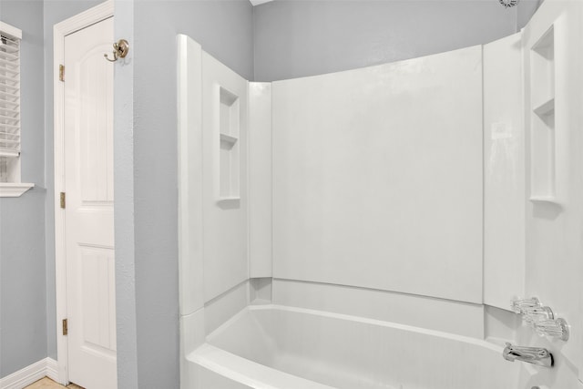 bathroom featuring washtub / shower combination