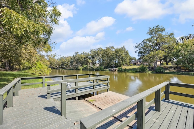 view of dock with a deck with water view