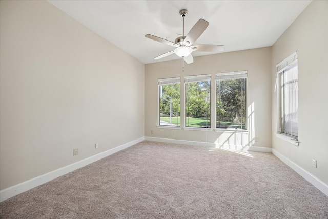 carpeted empty room with ceiling fan