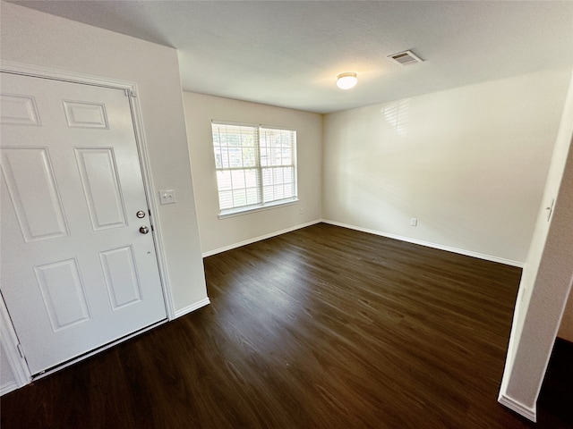 entryway with dark wood-type flooring