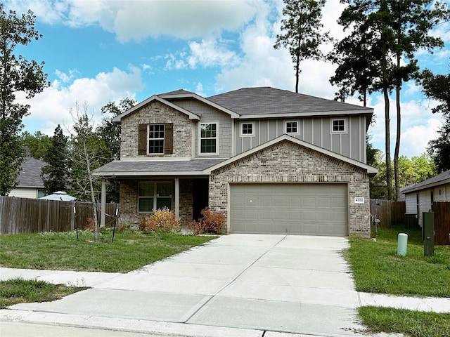 view of front facade with a front lawn and a garage