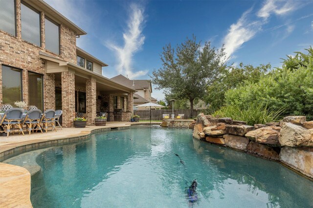 view of pool with a patio and area for grilling