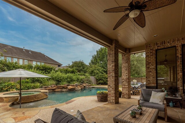 exterior space with an in ground hot tub, a patio area, and ceiling fan