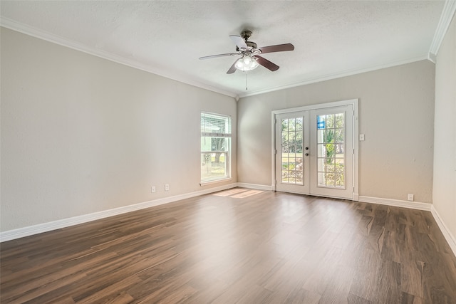 spare room with ceiling fan, dark hardwood / wood-style flooring, a textured ceiling, crown molding, and french doors