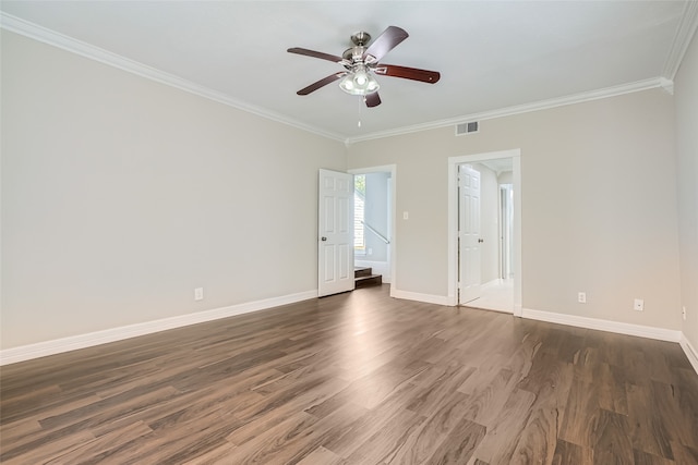 empty room with ornamental molding, dark hardwood / wood-style floors, and ceiling fan