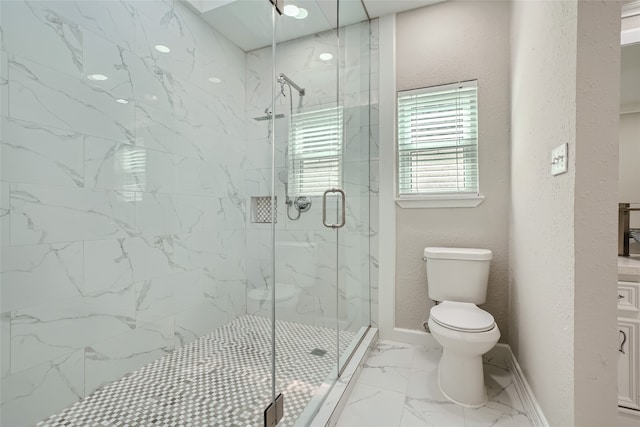 bathroom featuring toilet and a shower with shower door