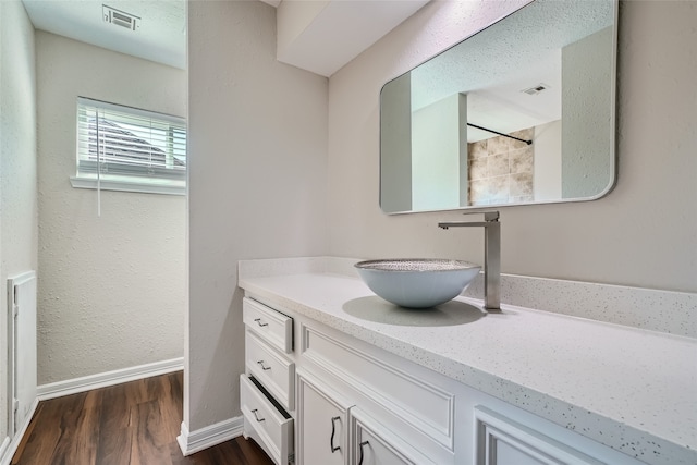 bathroom featuring vanity and hardwood / wood-style flooring