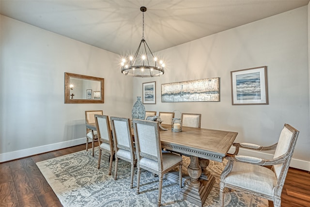 dining space with an inviting chandelier and dark wood-type flooring