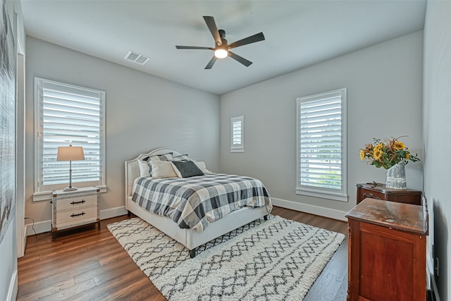 bedroom with dark wood-type flooring and ceiling fan