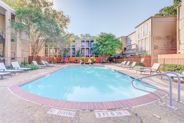 view of swimming pool with a patio