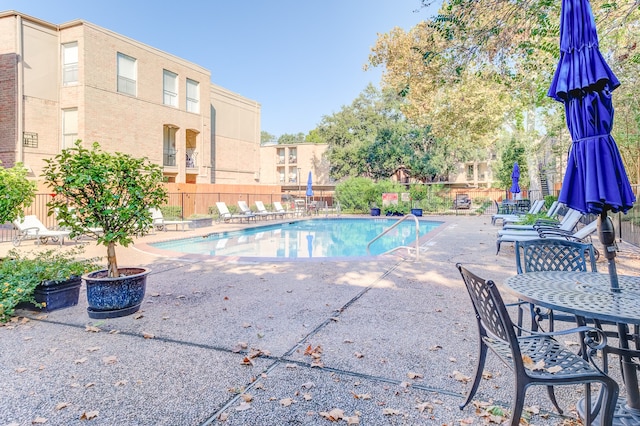 view of swimming pool featuring a patio