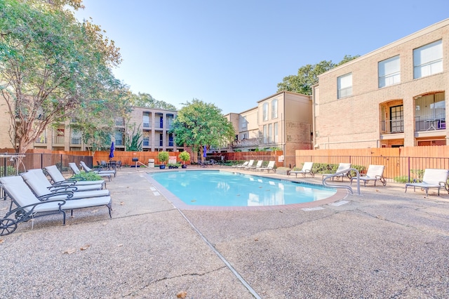 view of swimming pool with a patio area