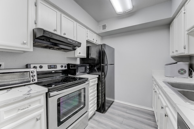 kitchen featuring light stone counters, black appliances, light wood-type flooring, and white cabinets