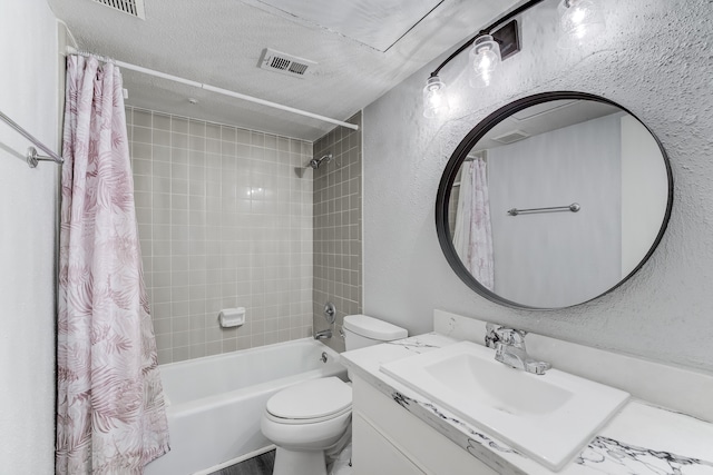 full bathroom with vanity, shower / bath combo, a textured ceiling, and toilet