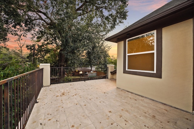 view of patio terrace at dusk