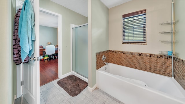 bathroom featuring tile patterned floors and plus walk in shower