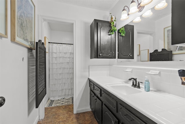 bathroom featuring vanity and curtained shower