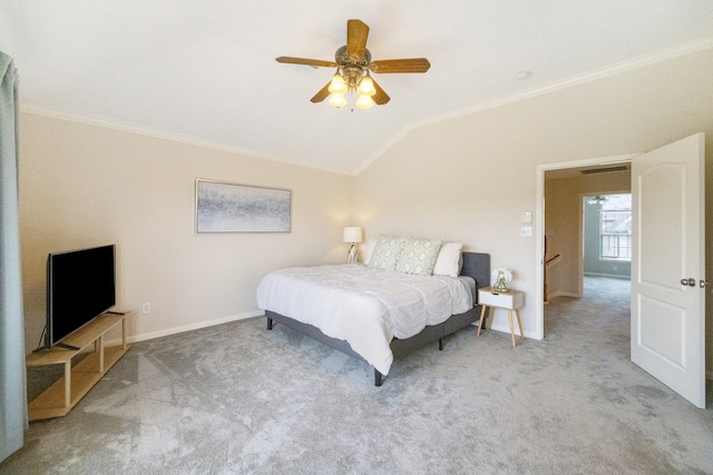 carpeted bedroom with ornamental molding, vaulted ceiling, and ceiling fan