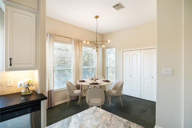 dining area featuring a chandelier