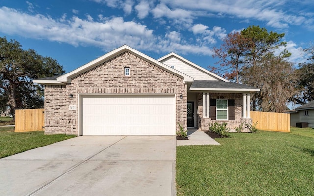 view of front of house featuring a garage and a front yard