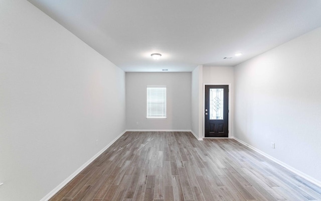 entryway with light hardwood / wood-style flooring