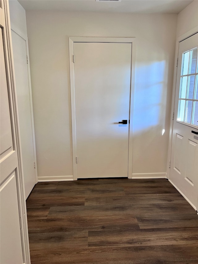 entryway with dark hardwood / wood-style floors