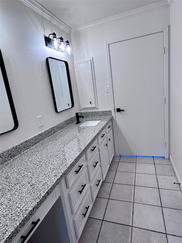 bathroom featuring vanity, ornamental molding, and tile patterned flooring