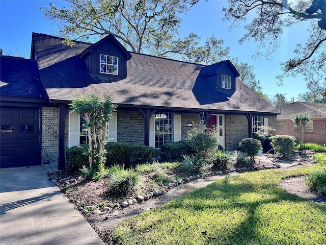 view of front facade with a garage and brick siding