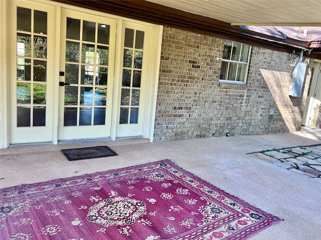 doorway to property featuring a patio area and french doors