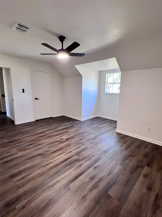 bonus room featuring dark wood-type flooring, ceiling fan, and vaulted ceiling