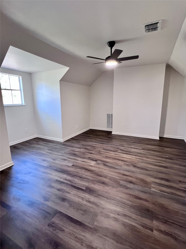 bonus room with ceiling fan, lofted ceiling, and dark hardwood / wood-style flooring