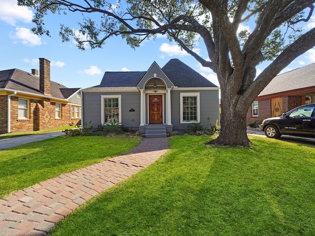 ranch-style house with a front yard