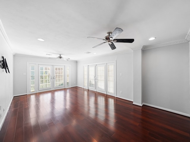 spare room featuring french doors, dark hardwood / wood-style floors, and crown molding